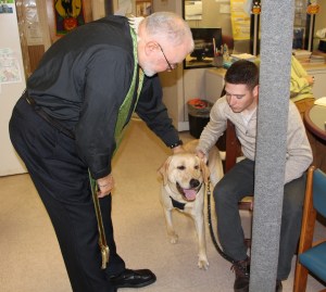 Rev. Rob Gildersleeve blesses pets during the annual Blessing of the Animals at Calvary Episcopal Church in Tamaqua.