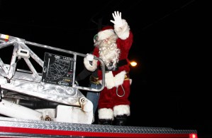 Santa arrived by Lansford Fire Company fire truck.