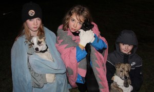 Holding their pets after the fire are Haily with "Chuck", Mya with "Storm", and Bowe with Chuck.