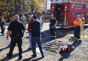 Pictured are Tamaqua police and firefighters looking over some of the equipment recovered after being stolen from a truck on scene of a fire this morning. It is not known if all items were recovered.