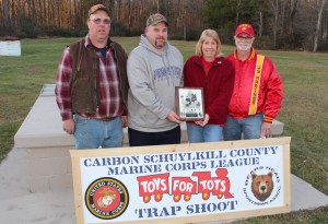 Pictured from left are event co-chairs Mike Ward and Jim Shaup; and Schuylkill Carbon Marine Corps League members Cheryl Laub, Toys For Tots coordinator, and James Laub.