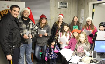 The festive group found time to sing a quick carol at the Coaldale Police Department.